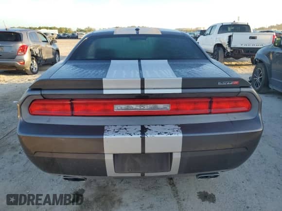 2013 Dodge Challenger SRT-8 с VIN 2C3CDYCJ1DH629258, выставлен на аукционе Copart как лот 84020745 с пробегом 193 657 миль миль и Списание • Salvage title. История ставок и продаж доступна на DreamBid. Изображение 6.