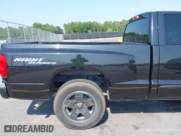 2006 Dodge Dakota SLT with VIN 1D7HE42NX6S666354, listed as a IAAI auction lot 42394779 with 124,633 mi miles and . Bid and sale history available at DreamBid. Image 13.