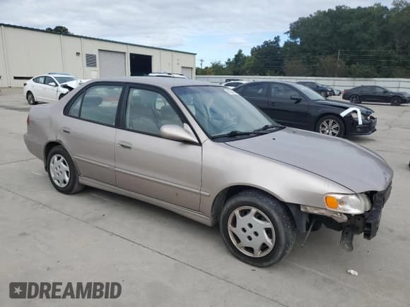 ✅ 1999 Toyota Corolla LE • VIN: 1NXBR12E6XZ148570 • Лот: 81554415. Опубликован ранее на Copart с пробегом 264 960 миль. Бесплатный доступ к архиву аукционных продаж из США и подробный отчёт об истории автомобиля на DreamBid. Изображение 4.