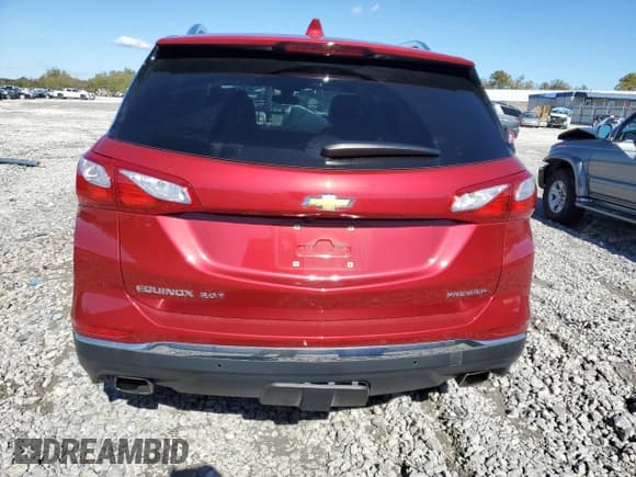 ✅ 2020 Chevrolet Equinox Premier • VIN: 3GNAXPEX9LS563230 • Лот: 90835155. Опубликован ранее на Copart с пробегом 33 021 миль. Бесплатный доступ к архиву аукционных продаж из США и подробный отчёт об истории автомобиля на DreamBid. Изображение 6.