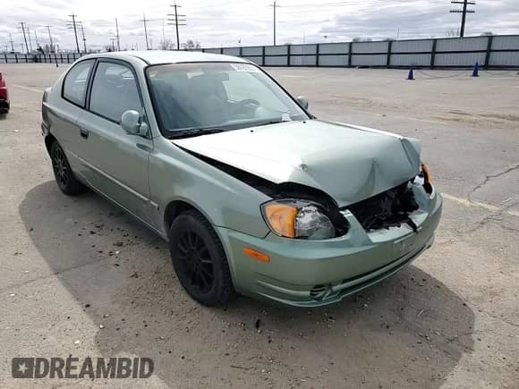 2003 Hyundai Accent GL z VIN KMHCG35C13U270585, wystawiony jako Copart lot #50197935 z przebiegiem 53 822 mil mil oraz Szkoda całkowita • Salvage title. Historia ofert i sprzedaży dostępna na DreamBid. Obrazek 11.
