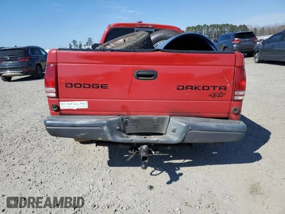 2004 Dodge Dakota z VIN 1D7GL12K34S504035, wystawiony jako Copart lot #46815725 z przebiegiem Nie podano mil oraz Szkoda całkowita • Salvage title. Historia ofert i sprzedaży dostępna na DreamBid. Obrazek 6.
