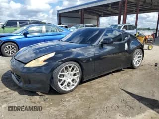 ✅ 2009 Nissan 370Z Touring • VIN: JN1AZ44E29M401808 • Лот: 86882755. Опубликован ранее на Copart с пробегом 142 523 миль. Бесплатный доступ к архиву аукционных продаж из США и подробный отчёт об истории автомобиля на DreamBid. Изображение 1.