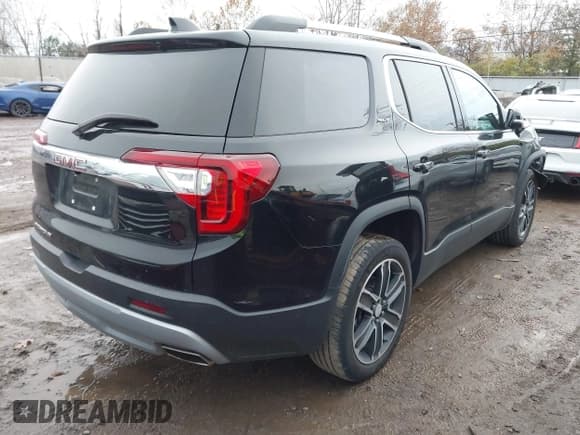 ✅ 2023 GMC Acadia SLT • VIN: 1GKKNMLS1PZ222281 • Lot: 43660865. Listed on IAAI with 46,873 mi. Free auction sales archive from the USA and detailed vehicle history report at DreamBid. Image 4.