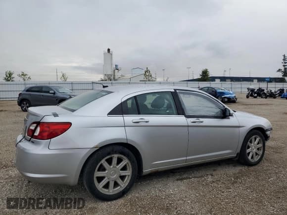 ✅ 2007 Chrysler Sebring Touring • VIN: 1C3LC56R77N528143 • Лот: 85285685. Опубликован ранее на Copart с пробегом 198 305 миль. Бесплатный доступ к архиву аукционных продаж из США и подробный отчёт об истории автомобиля на DreamBid. Изображение 3.