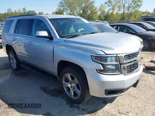 2015 Chevrolet Tahoe LT z VIN 1GNSKBKCXFR727759, wystawiony jako IAAI lot #43210647 z przebiegiem 129 750 mil mil oraz . Historia ofert i sprzedaży dostępna na DreamBid. Obrazek 1.