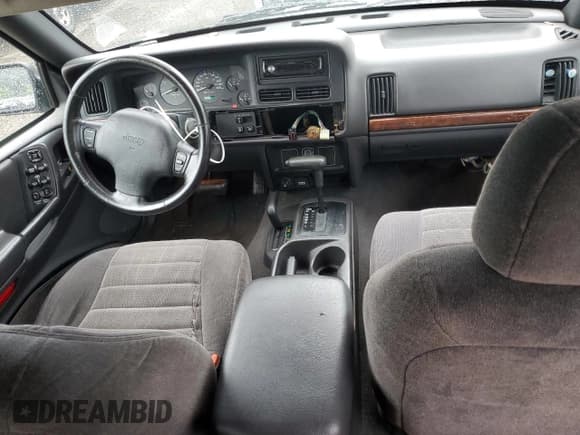 ✅ 1998 Jeep Grand Cherokee Laredo • VIN: 1J4GZ58SXWC144437 • Лот: 60437094. Опубликован ранее на Copart с пробегом 183 908 миль. Бесплатный доступ к архиву аукционных продаж из США и подробный отчёт об истории автомобиля на DreamBid. Изображение 8.