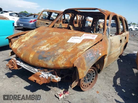 2005 Chevrolet Tahoe LT with VIN 1GNEC13T35R103223, listed as a IAAI auction lot 42165644 with Not provided miles and . Bid and sale history available at DreamBid. Image 2.