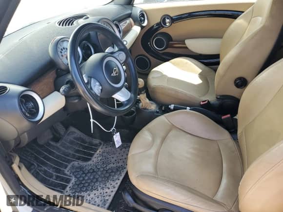 2009 MINI Hardtop with VIN WMWMF33539TT69081, listed as a Copart auction lot 58087205 with 106,470 mi miles and Salvage title. Bid and sale history available at DreamBid. Image 7.