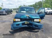 ✅ 1999 Isuzu Rodeo S • VIN: 4S2CK58W6X4332027 • Lot: 42087396. Listed on IAAI with 258,508 mi. Free auction sales archive from the USA and detailed vehicle history report at DreamBid. Image 11.