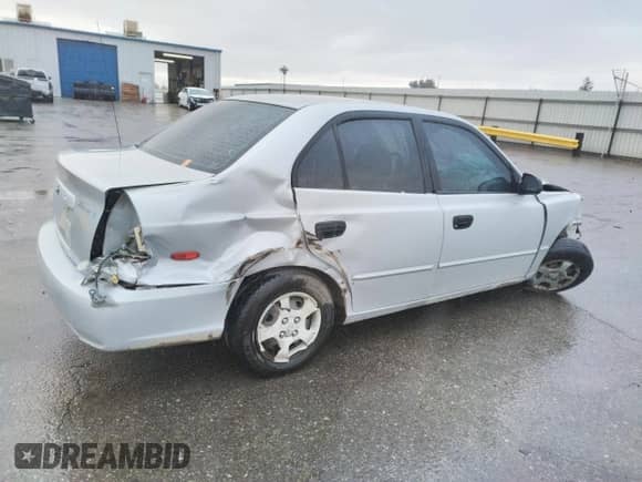 2002 Hyundai Accent GL with VIN KMHCG45C02U301443, listed as a Copart auction lot 80670164 with 124,163 mi miles and Salvage title. Bid and sale history available at DreamBid. Image 3.