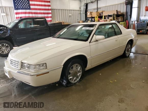 ✅ 1998 Cadillac Eldorado Touring • VIN: 1G6ET1291TU618488 • Lot: 65851485. Listed on Copart with 120,718 mi. Free auction sales archive from the USA and detailed vehicle history report at DreamBid. Image 1.