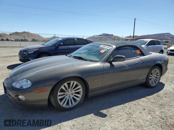 ✅ 2005 Jaguar XK XK8 • VIN: SAJDA42C452A41017 • Лот: 65583134. Опубликован ранее на Copart с пробегом 143 024 миль. Бесплатный доступ к архиву аукционных продаж из США и подробный отчёт об истории автомобиля на DreamBid. Изображение 1.