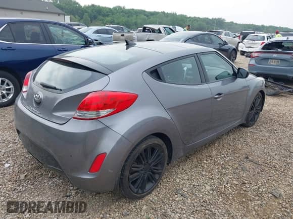 2012 Hyundai Veloster w/Gray Int z VIN KMHTC6ADXCU030284, wystawiony jako IAAI lot #42445394 z przebiegiem 156 536 mil mil oraz . Historia ofert i sprzedaży dostępna na DreamBid. Obrazek 4.