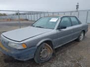 ✅ 1990 Toyota Camry DLX • VIN: 4T1SV21EXLU271320 • Лот: 41798353. Опубликован ранее на IAAI с пробегом 269 178 миль. Бесплатный доступ к архиву аукционных продаж из США и подробный отчёт об истории автомобиля на DreamBid. Изображение 2.