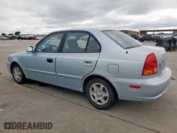 2003 Hyundai Accent GL z VIN KMHCG45C73U481294, wystawiony jako Copart lot #55958005 z przebiegiem 136 964 mil mil oraz Czysty tytuł • Clean title. Historia ofert i sprzedaży dostępna na DreamBid. Obrazek 2.