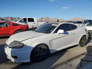 2006 Hyundai Tiburon GT z VIN KMHHN65F26U190479, wystawiony jako Copart lot #87292024 z przebiegiem 141 129 mil mil oraz Szkoda całkowita • Salvage title. Historia ofert i sprzedaży dostępna na DreamBid. Obrazek 1.