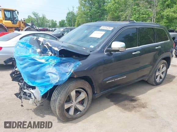 ✅ 2015 Jeep Grand Cherokee Limited • VIN: 1C4RJFBG5FC197773 • Lot: 42161048. Listed on IAAI with 128,257 mi. Free auction sales archive from the USA and detailed vehicle history report at DreamBid. Image 16.