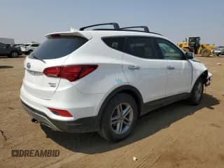 ✅ 2017 Hyundai Santa Fe 2.4L • VIN: 5XYZUDLBXHG427112 • Лот: 64670994. Опубликован ранее на Copart с пробегом 76 720 миль. Бесплатный доступ к архиву аукционных продаж из США и подробный отчёт об истории автомобиля на DreamBid. Изображение 3.