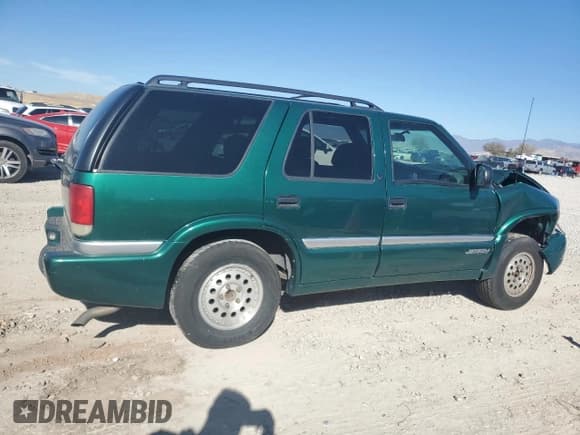 ✅ 2000 GMC Jimmy SLE Convenience • VIN: 1GKDT13W3Y2215035 • Lot: 77484104. Listed on Copart with 116,124 mi. Free auction sales archive from the USA and detailed vehicle history report at DreamBid. Image 3.