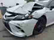 2021 Toyota Camry Hybrid XSE with VIN 4T1K31AK6MU020821, listed as a IAAI auction lot 42283548 with 61,171 mi miles and . Bid and sale history available at DreamBid. Image 6.