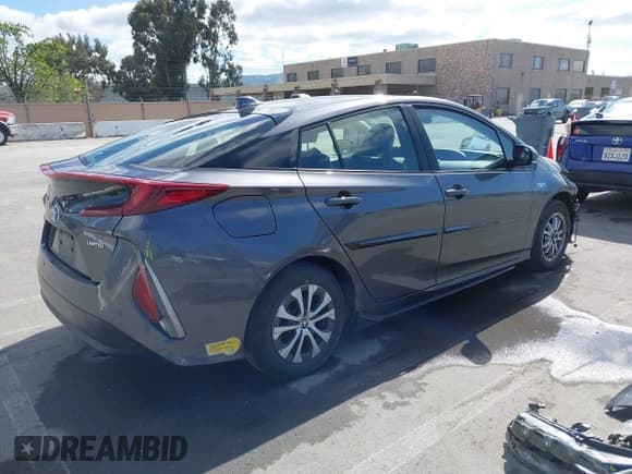 ✅ 2022 Toyota Prius LE • VIN: JTDKAMFP7N3206830 • Lot: 41984239. Listed on IAAI with 57,681 mi. Free auction sales archive from the USA and detailed vehicle history report at DreamBid. Image 4.