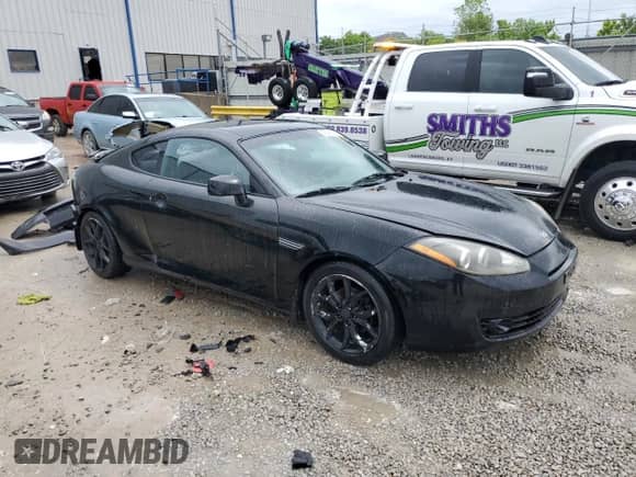 2008 Hyundai Tiburon GT с VIN KMHHN66F08U289898, выставлен на аукционе Copart как лот 56485235 с пробегом 169 568 миль миль и На запчасти • Non repairable. История ставок и продаж доступна на DreamBid. Изображение 4.