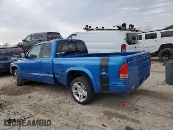1999 Dodge Dakota Sport z VIN 1B7GL22Z7XS110023, wystawiony jako Copart lot #85889754 z przebiegiem Nie podano mil oraz Szkoda całkowita • Salvage title. Historia ofert i sprzedaży dostępna na DreamBid. Obrazek 2.