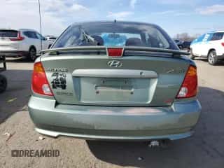 2003 Hyundai Accent GL with VIN KMHCG35CX3U242820, listed as a Copart auction lot 45971325 with 132,192 mi miles and Salvage title. Bid and sale history available at DreamBid. Image 6.