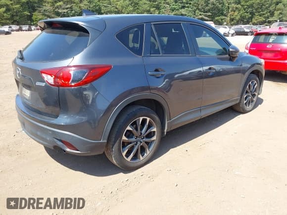 ✅ 2016 Mazda CX-5 Grand Touring • VIN: JM3KE2DYXG0769581 • Lot: 43174558. Listed on IAAI with 206,517 mi. Free auction sales archive from the USA and detailed vehicle history report at DreamBid. Image 4.