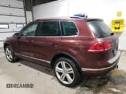 ✅ 2017 Volkswagen Touareg Executive • VIN: WVGGF7BP5HD001497 • Lot: 39641554. Listed on Copart with 81,525 mi. Free auction sales archive from the USA and detailed vehicle history report at DreamBid. Image 2.
