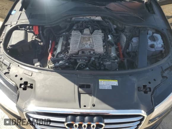 ✅ 2018 Audi A8 • VIN: WAU44AFD0JN000782 • Лот: 68575924. Опубликован ранее на Copart с пробегом 99 098 миль. Бесплатный доступ к архиву аукционных продаж из США и подробный отчёт об истории автомобиля на DreamBid. Изображение 14.