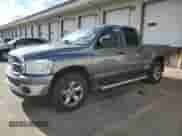 2007 Dodge 1500 SLT z VIN 1D7HU18257S135949, wystawiony jako Copart lot #87294805 z przebiegiem 168 407 mil mil oraz Czysty tytuł • Clean title. Historia ofert i sprzedaży dostępna na DreamBid. Obrazek 1.