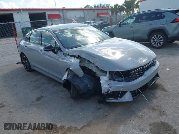 ✅ 2025 Kia K5 GT-Line • VIN: KNAG64J7XS5304309 • Lot: 42027120. Listed on IAAI with 16,928 mi. Free auction sales archive from the USA and detailed vehicle history report at DreamBid. Image 1.