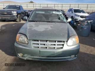 2003 Hyundai Accent GL with VIN KMHCG35CX3U242848, listed as a Copart auction lot 86558394 with 56,248 mi miles and Salvage title. Bid and sale history available at DreamBid. Image 5.