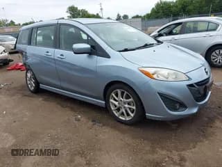 ✅ 2012 Mazda 5 Touring • VIN: JM1CW2CL2C0130024 • Lot: 43020154. Listed on IAAI with 145,905 mi. Free auction sales archive from the USA and detailed vehicle history report at DreamBid. Image 1.