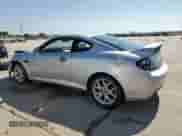 2008 Hyundai Tiburon GT z VIN KMHHN66F98U267849, wystawiony jako Copart lot #88506815 z przebiegiem 92 820 mil mil oraz Szkoda całkowita • Salvage title. Historia ofert i sprzedaży dostępna na DreamBid. Obrazek 2.