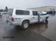 2003 Dodge Dakota Sport z VIN 1D7HG38N83S265442, wystawiony jako Copart lot #84969985 z przebiegiem Nie podano mil oraz Szkoda całkowita • Salvage title. Historia ofert i sprzedaży dostępna na DreamBid. Obrazek 3.