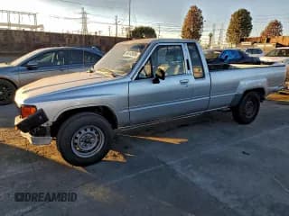 ✅ 1987 Toyota Pickup • VIN: JT4RN70DXH0032048 • Lot: 96103695. Listed on Copart with 214,639 mi. Free auction sales archive from the USA and detailed vehicle history report at DreamBid. Image 1.