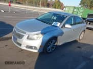 ✅ 2014 Chevrolet Cruze LTZ • VIN: 1G1PG5SB9E7158463 • Lot: 43589752. Listed on IAAI with 113,302 mi. Free auction sales archive from the USA and detailed vehicle history report at DreamBid. Image 2.