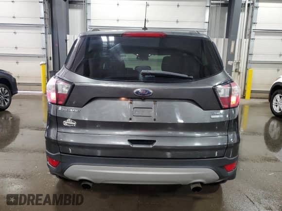 2018 Ford Escape SE с VIN 1FMCU9GD3JUB57039, выставлен на аукционе Copart как лот 65642995 с пробегом 154 325 миль миль и Списание • Salvage title. История ставок и продаж доступна на DreamBid. Изображение 6.