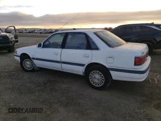 ✅ 1992 Mazda 626 • VIN: 1YVGD22B7N5214355 • Lot: 86899014. Listed on Copart with 89,811 mi. Free auction sales archive from the USA and detailed vehicle history report at DreamBid. Image 2.