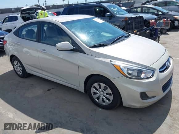 2015 Hyundai Accent GLS z VIN KMHCT4AE4FU936500, wystawiony jako IAAI lot #43347520 z przebiegiem 143 412 mil mil oraz . Historia ofert i sprzedaży dostępna na DreamBid. Obrazek 1.