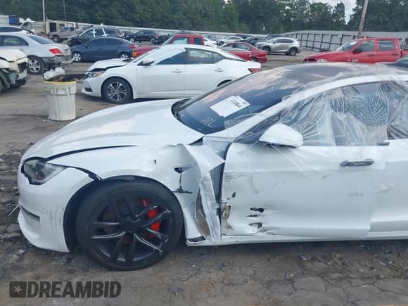 ✅ 2023 Tesla Model S Plaid • VIN: 5YJSA1E63PF521945 • Lot: 43248046. Listed on IAAI with 26,327 mi. Free auction sales archive from the USA and detailed vehicle history report at DreamBid. Image 12.