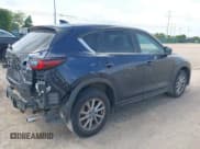 ✅ 2023 Mazda CX-5 S Carbon Edition • VIN: JM3KFBCM6P0165036 • Lot: 42622732. Listed on IAAI with 44,497 mi. Free auction sales archive from the USA and detailed vehicle history report at DreamBid. Image 4.