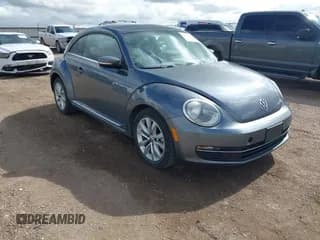 ✅ 2014 Volkswagen Beetle 2.0L TDI w/Sun/Sound/Nav • VIN: 3VWJL7ATXEM635807 • Лот: 42641370. Опубликован ранее на IAAI с пробегом 70 279 миль. Бесплатный доступ к архиву аукционных продаж из США и подробный отчёт об истории автомобиля на DreamBid. Изображение 1.