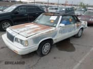 ✅ 1986 Chrysler LeBaron Mark Cross • VIN: 1C3BC55E8GG300487 • Lot: 42572953. Wystawiony na IAAI z przebiegiem 31 206 mil. Bezpłatny archiwum sprzedaży aukcyjnych z USA i szczegółowy raport historii pojazdu na DreamBid. Zdjęcie 2.