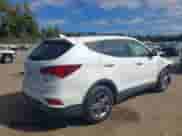 2018 Hyundai Santa Fe 2.4L z VIN 5NMZUDLB6JH078395, wystawiony jako IAAI lot #43277067 z przebiegiem 82 038 mil mil oraz . Historia ofert i sprzedaży dostępna na DreamBid. Obrazek 4.
