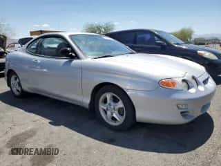 2001 Hyundai Tiburon с VIN KMHJG25F11U258137, выставлен на аукционе Copart как лот 63812855 с пробегом 27 682 миль миль и Чистый • Clean title. История ставок и продаж доступна на DreamBid. Изображение 4.