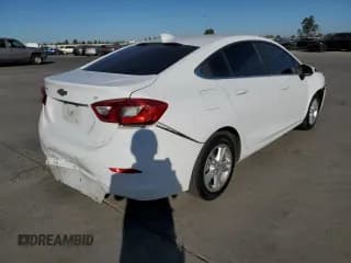 ✅ 2018 Chevrolet Cruze LT • VIN: 1G1BE5SM3J7199215 • Lot: 64859662. Listed on Copart with 113,424 mi. Free auction sales archive from the USA and detailed vehicle history report at DreamBid. Image 4.